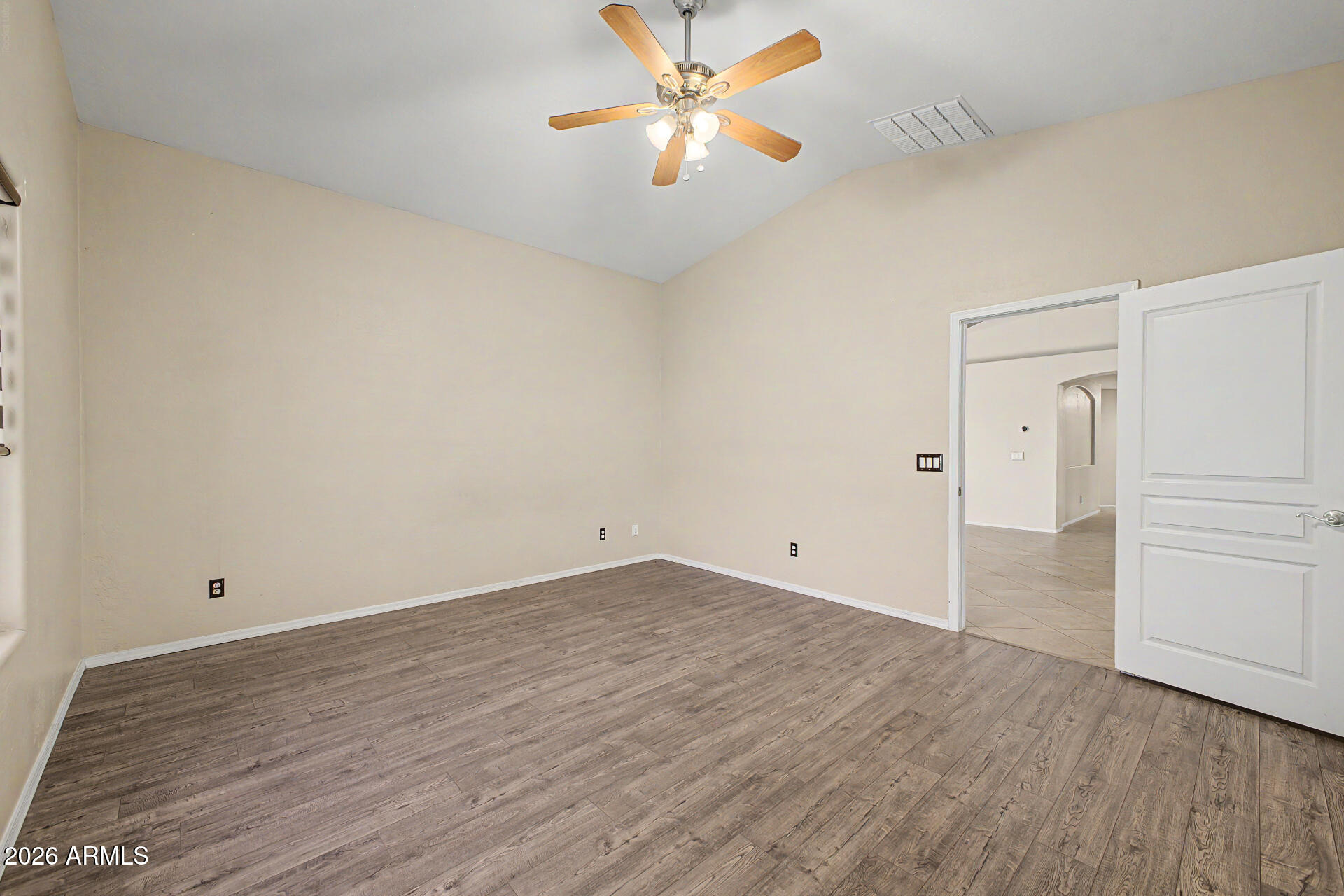 2340 West Apollo Road Phoenix, AZ 85041 - Photo 12 of 26 wooden floor in an empty room