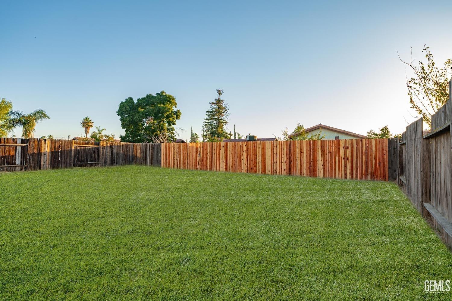 Undisclosed Address Bakersfield, CA 93307 - Photo 14 of 14 a view of a backyard with entertaining space