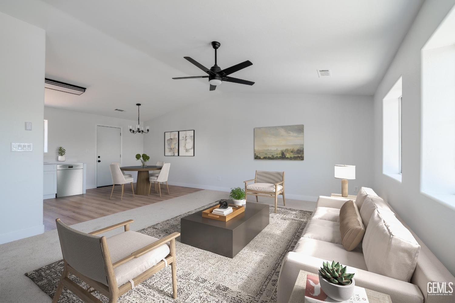 Undisclosed Address Bakersfield, CA 93307 - Photo 2 of 14 a living room with furniture and a table