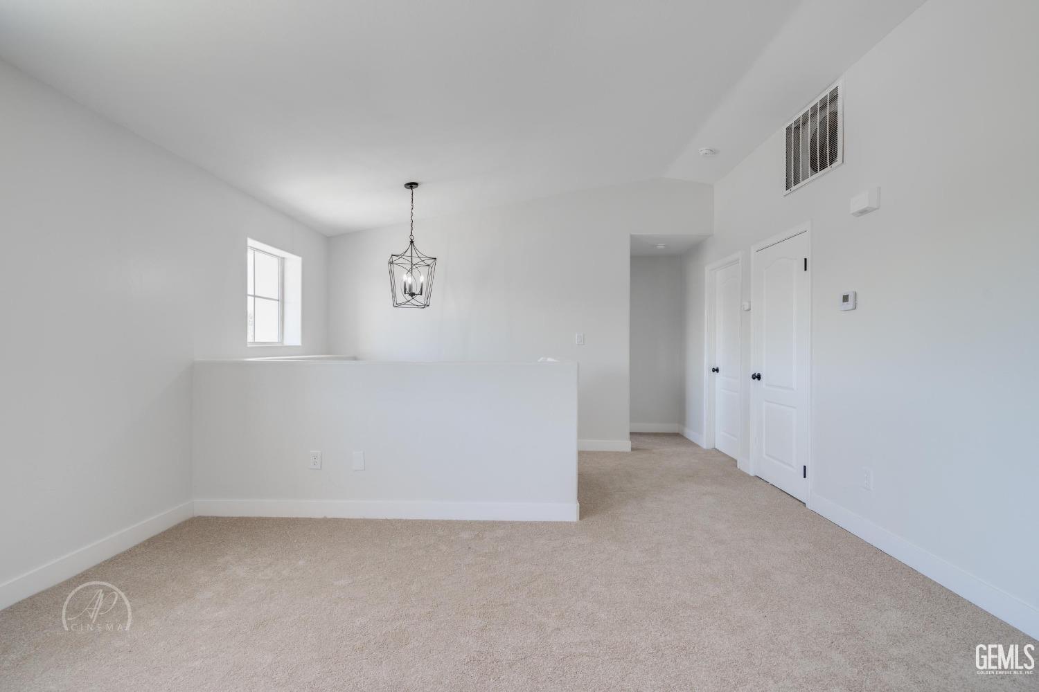 Undisclosed Address Bakersfield, CA 93307 - Photo 4 of 14 an empty room with windows