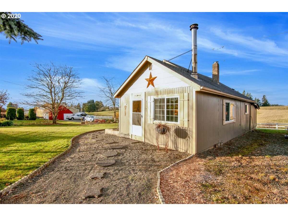 37161 Southeast Trubel Road Sandy, OR 97055 - Photo 1 of 27 a front view of a house with garden