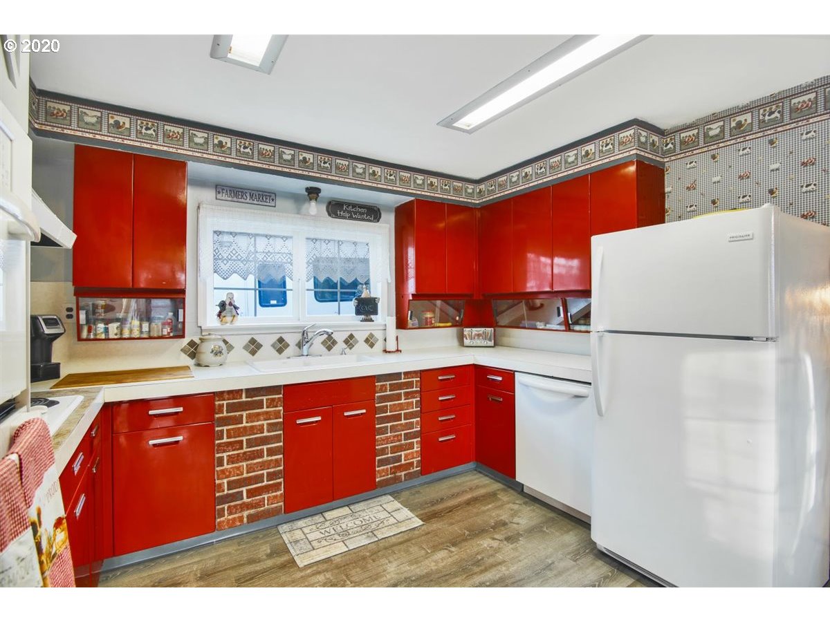 37161 Southeast Trubel Road Sandy, OR 97055 - Photo 12 of 27 a kitchen with stainless steel appliances granite countertop a refrigerator a stove and sink