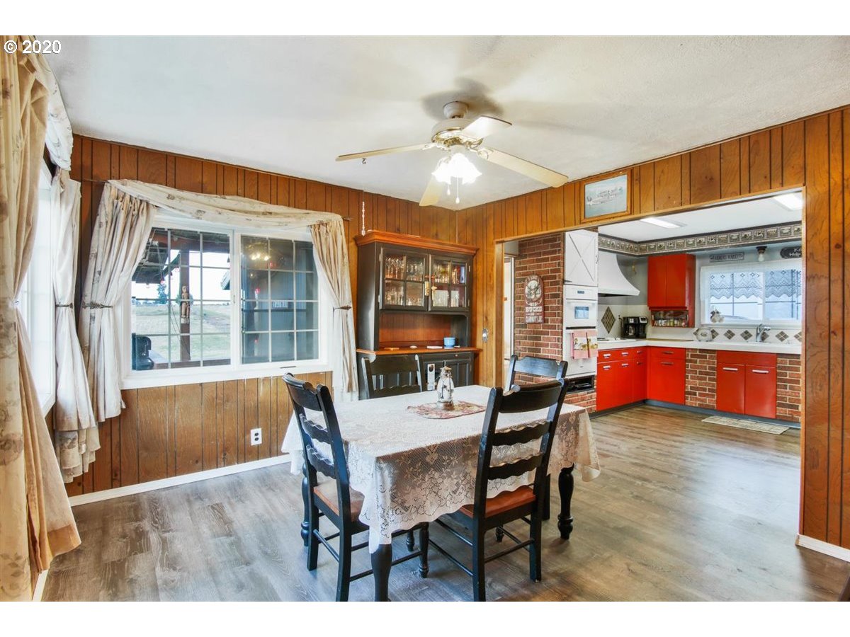 37161 Southeast Trubel Road Sandy, OR 97055 - Photo 15 of 27 a living room with stainless steel appliances kitchen island granite countertop furniture and a kitchen view