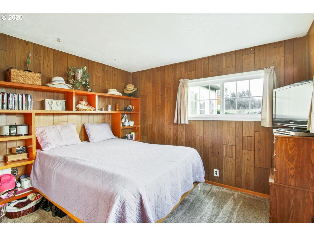 37161 Southeast Trubel Road Sandy, OR 97055 - Photo 16 of 27 a bedroom with a bed and a book shelf