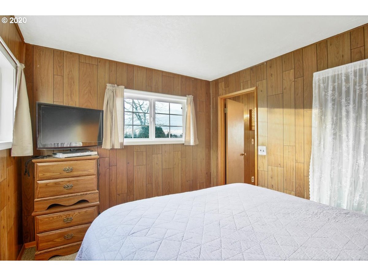 37161 Southeast Trubel Road Sandy, OR 97055 - Photo 17 of 27 a bedroom with a bed and a flat screen tv