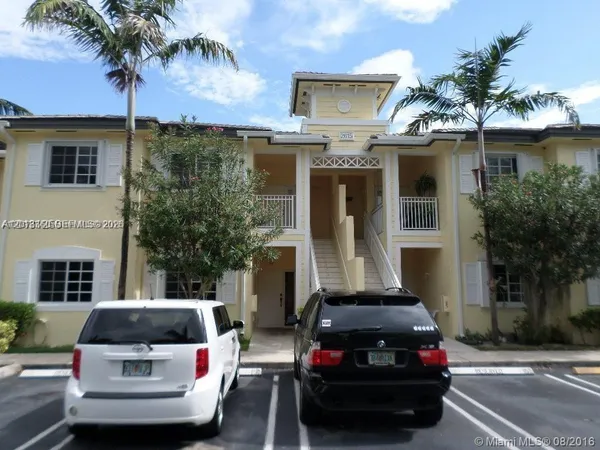 a car parked in front of a house