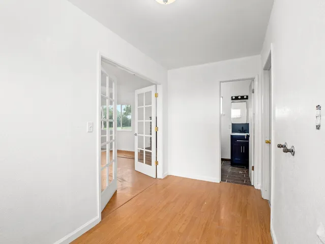a view of a pool with an outdoor space and seating area