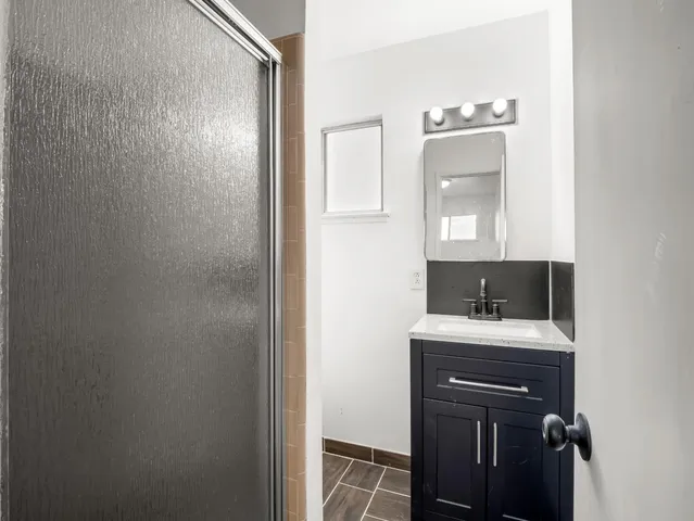 a view of a field with large trees