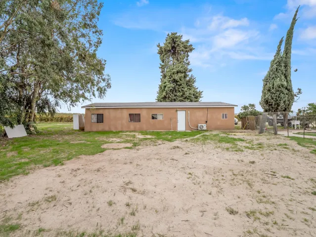 a kitchen with a sink and a refrigerator
