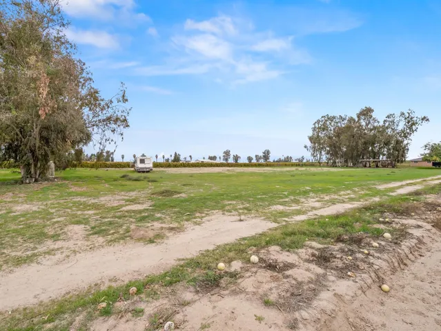 a kitchen with stainless steel appliances granite countertop cabinets and window