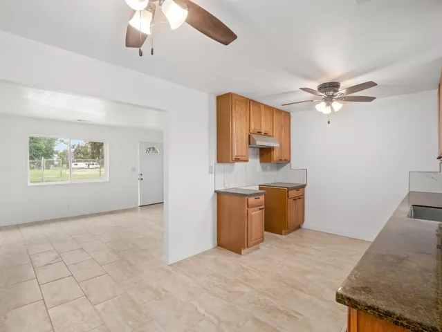 a bathroom with a sink a toilet and vanity