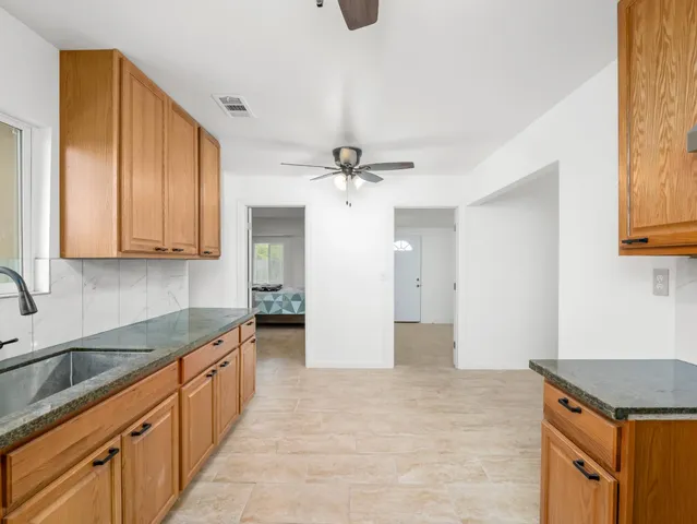 a view of a big yard with a house