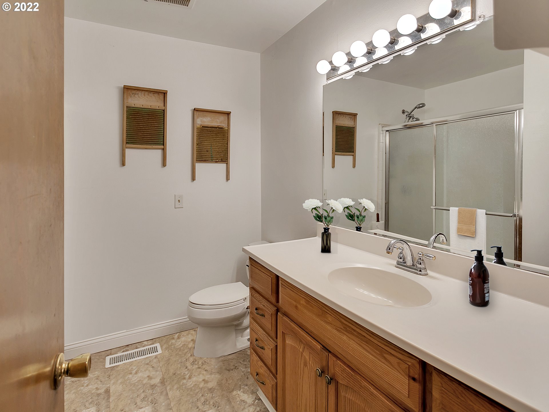 8730 Southwest River Road Hillsboro, OR 97123 - Photo 29 of 32 a bathroom with a sink a toilet and shower