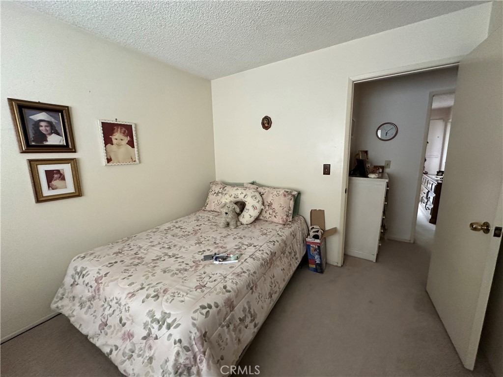 10451 Mulhall Street, Unit 25 El Monte, CA 91731 - Photo 15 of 21 a bedroom with a bed and walk in closet