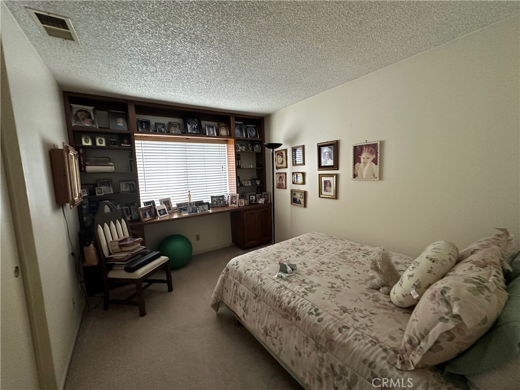 10451 Mulhall Street, Unit 25 El Monte, CA 91731 - Photo 16 of 21 a bedroom with a bed and a couch