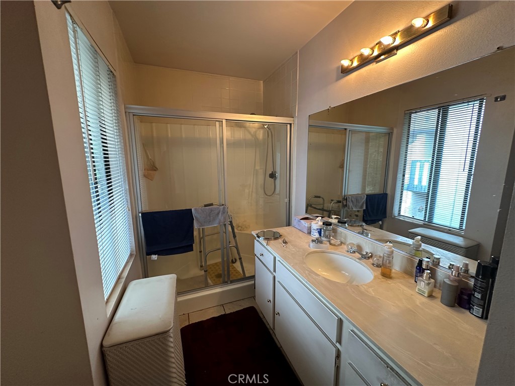 10451 Mulhall Street, Unit 25 El Monte, CA 91731 - Photo 18 of 21 a bathroom with a double vanity sink and a mirror