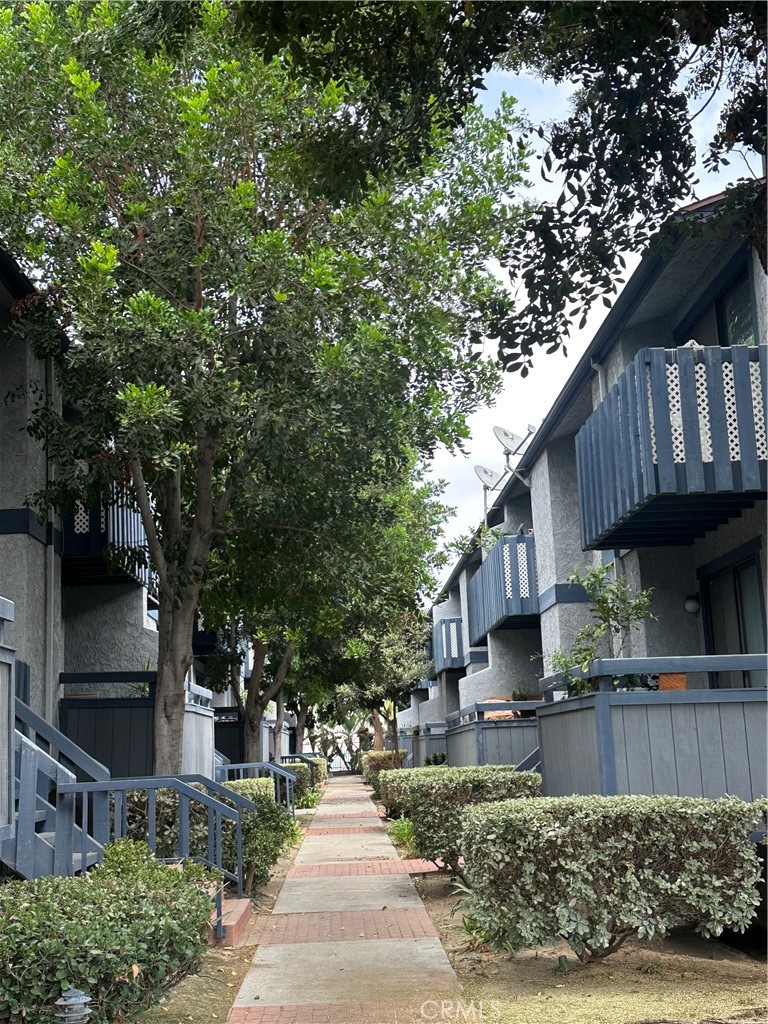 10451 Mulhall Street, Unit 25 El Monte, CA 91731 - Photo 2 of 21 a front view of a house with garden