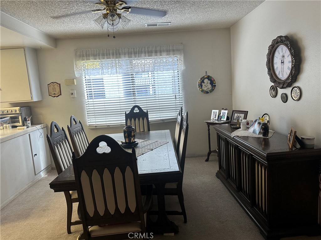 10451 Mulhall Street, Unit 25 El Monte, CA 91731 - Photo 7 of 21 a view of a dining room with furniture window and wooden floor
