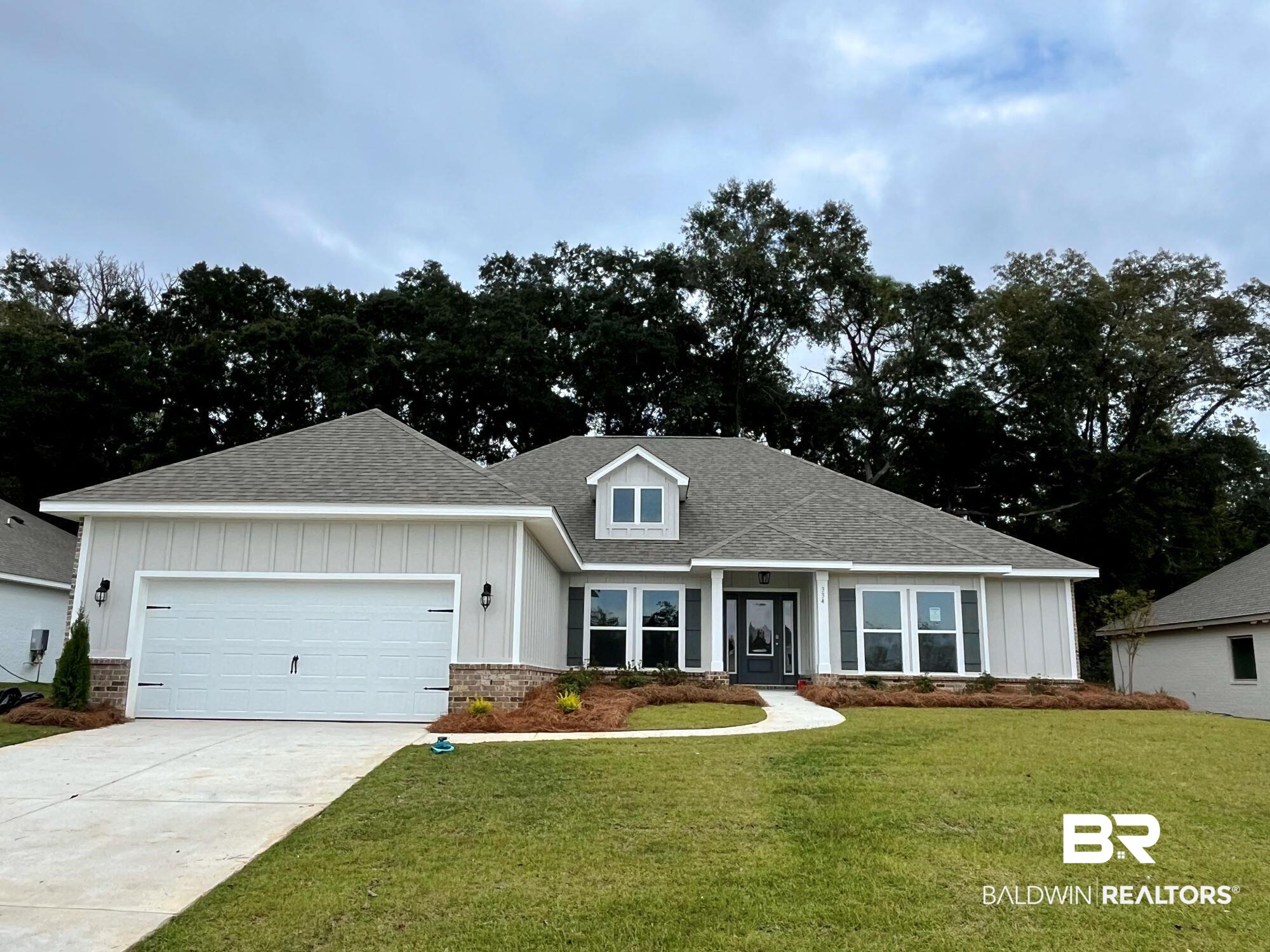 334 Barndling Street Fairhope, AL 36532 - Photo 1 of 34 Craftsman inspired home featuring a garage and a front lawn