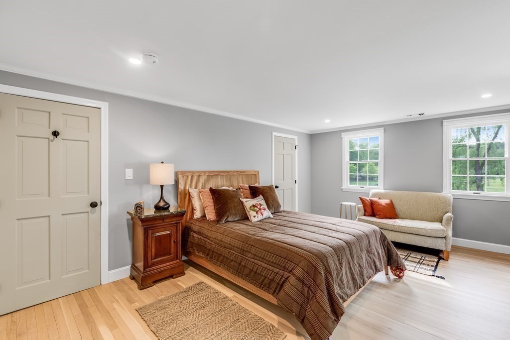 3 Longmeadow Way Hamilton, MA 01982 - Photo 18 of 41 a bedroom with a bed and a couch