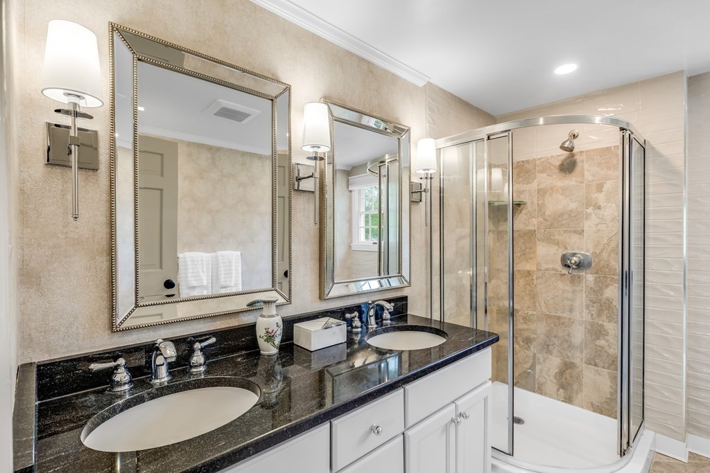 3 Longmeadow Way Hamilton, MA 01982 - Photo 20 of 41 a bathroom with a granite countertop double vanity sink mirror and shower