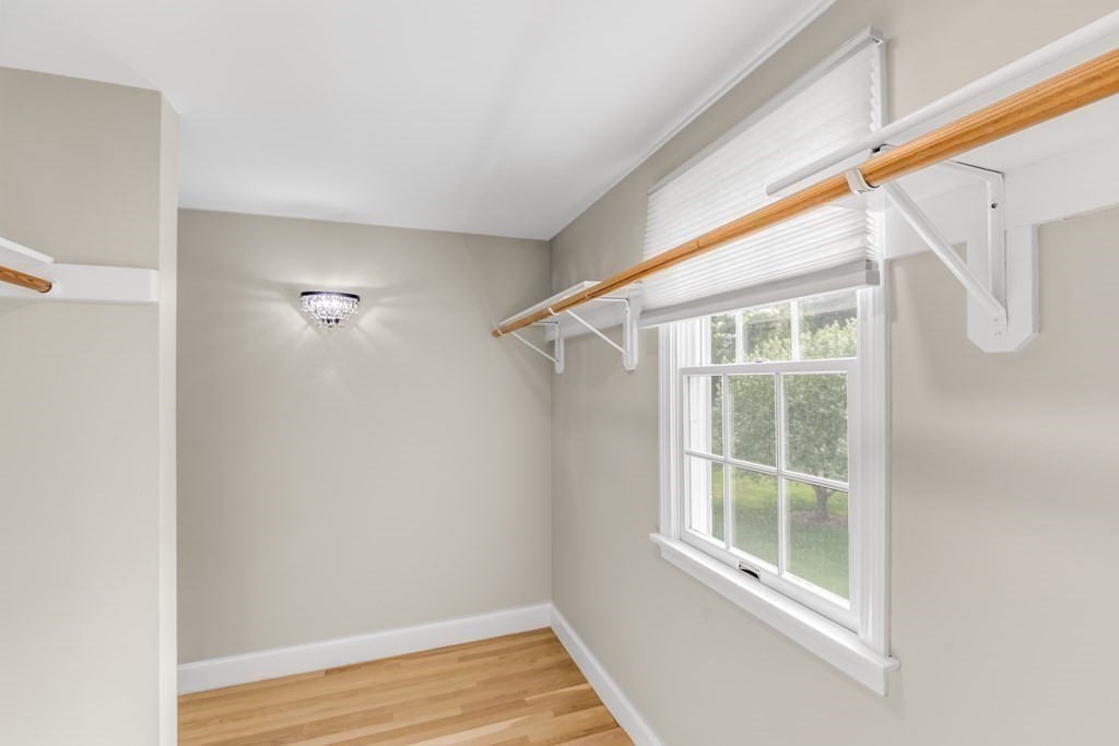 3 Longmeadow Way Hamilton, MA 01982 - Photo 21 of 41 a view of an empty room with wooden floor and windows