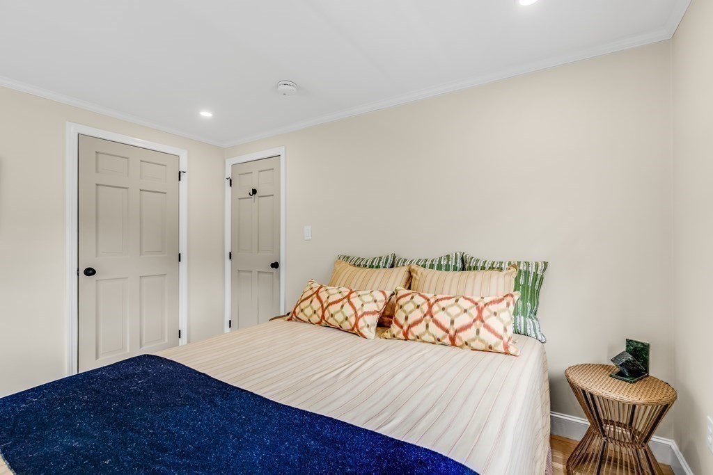 3 Longmeadow Way Hamilton, MA 01982 - Photo 23 of 41 a view of a bedroom with wooden floor and a bed