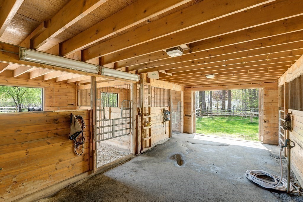 3 Longmeadow Way Hamilton, MA 01982 - Photo 33 of 41 a view of a room with wooden walls and iron stairs