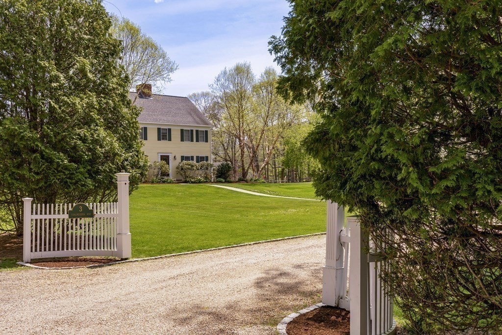 3 Longmeadow Way Hamilton, MA 01982 - Photo 4 of 41 a front view of a house with a garden and yard