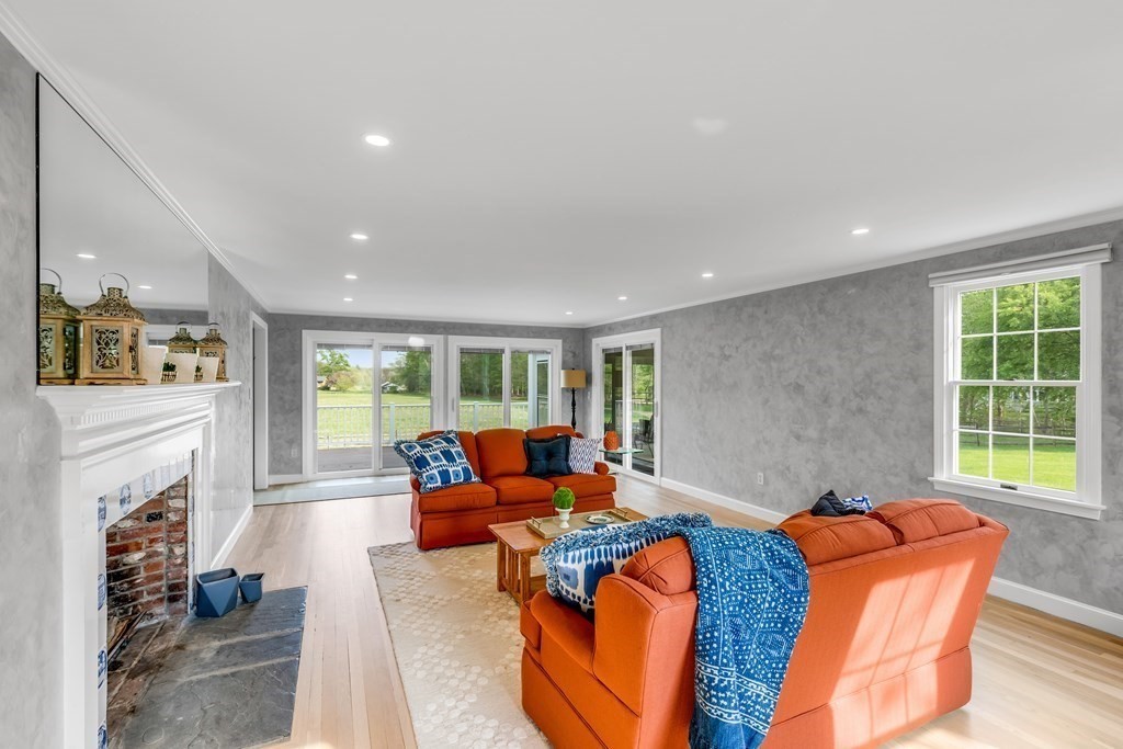 3 Longmeadow Way Hamilton, MA 01982 - Photo 7 of 41 a living room with furniture and a fireplace