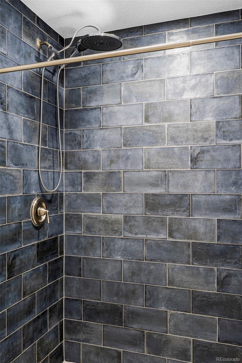 862 South Reed Court, Unit J Lakewood, CO 80226 - Photo 25 of 37 a bathroom with a shower