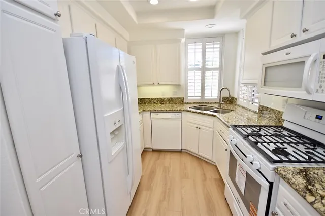 a kitchen with a stove a refrigerator and a stove