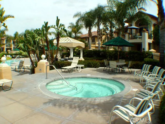 a swimming pool with outdoor seating yard and barbeque oven