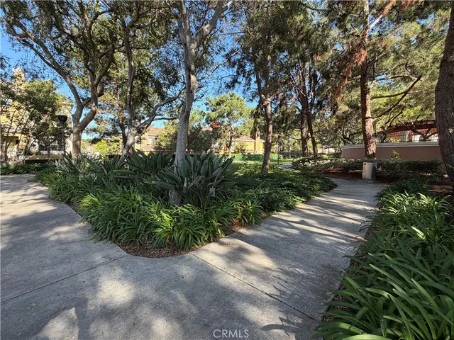 a black and white building with trees in front of it