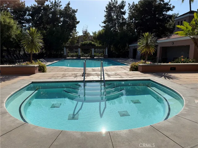 a view of a patio with a table and chairs
