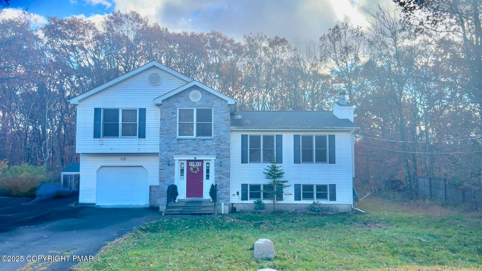 a front view of a house with garden