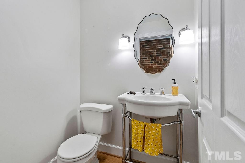 5409 Alpine Drive Raleigh, NC 27609 - Photo 16 of 30 Lovely updated half bath located between mudroom and breakfast nook!
