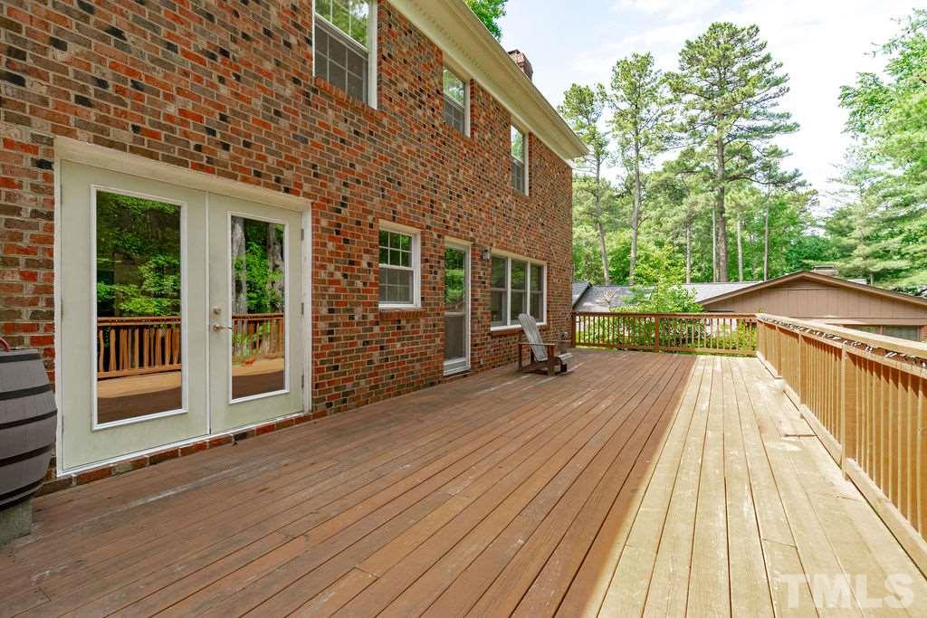 5409 Alpine Drive Raleigh, NC 27609 - Photo 26 of 30 Huge deck to enjoy private backyard and family gatherings!