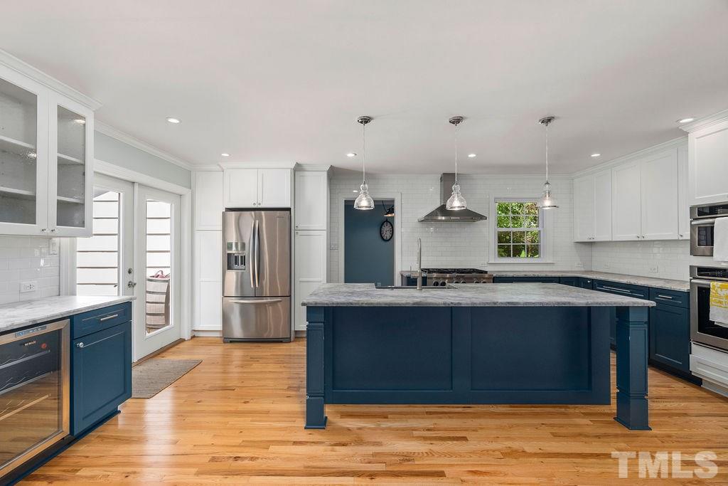 5409 Alpine Drive Raleigh, NC 27609 - Photo 10 of 30 Custom updated kitchen with honed granite tops!