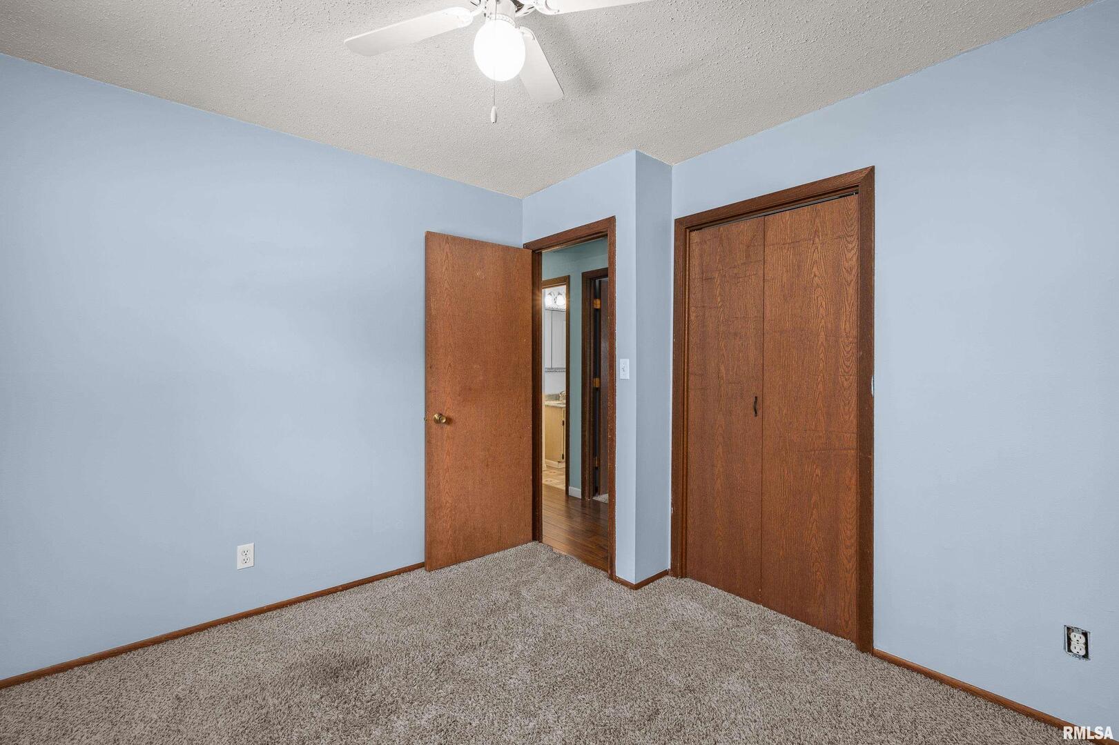 617 6th Street Camanche, IA 52730 - Photo 11 of 25 an empty room with fan