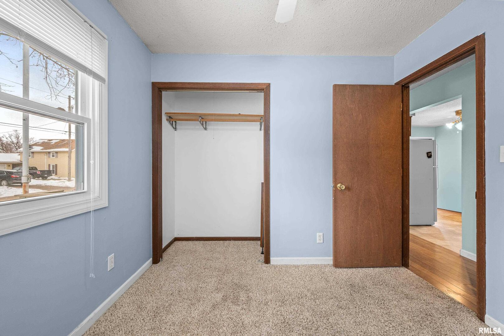 617 6th Street Camanche, IA 52730 - Photo 14 of 25 a view of an empty room with a window