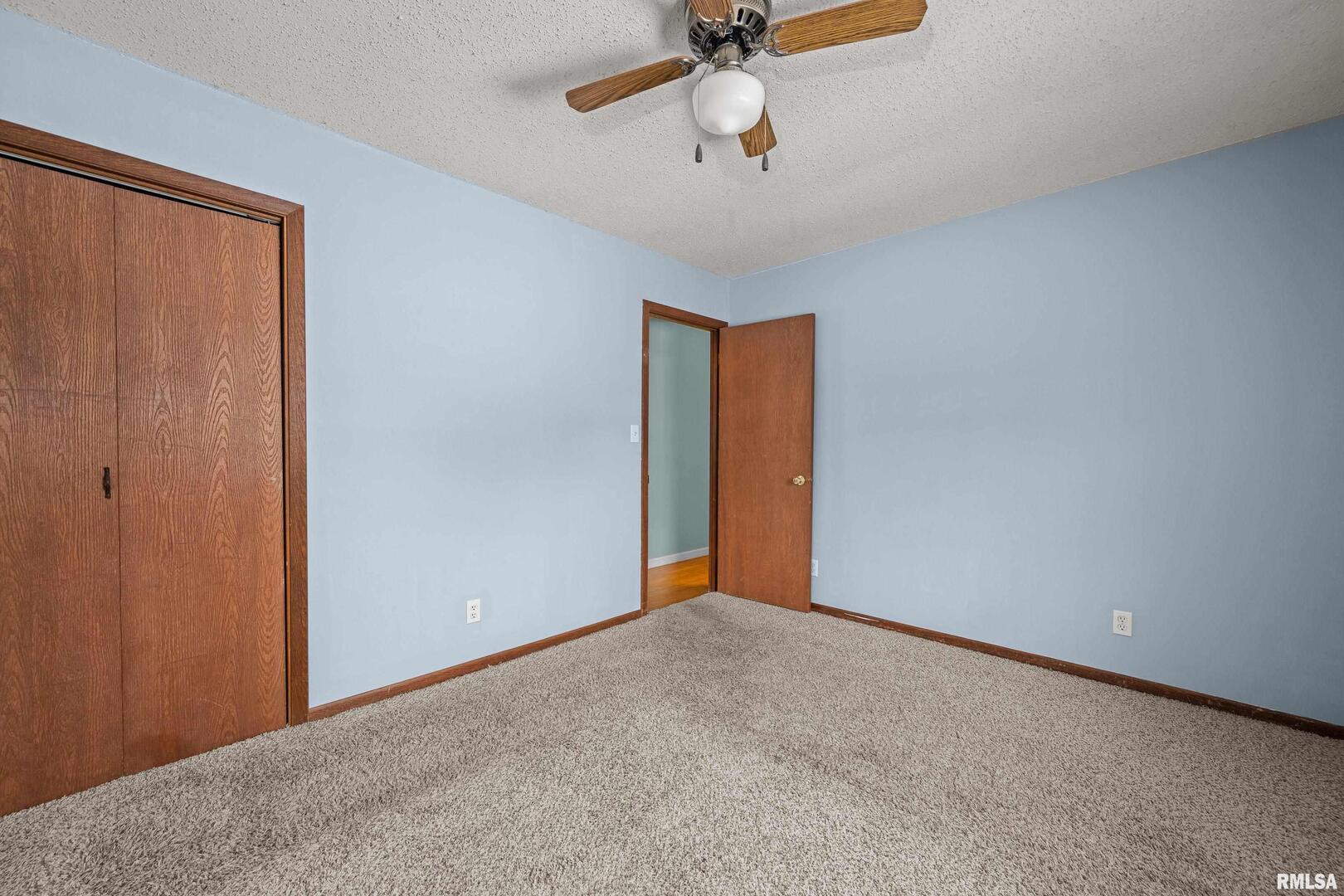 617 6th Street Camanche, IA 52730 - Photo 16 of 25 a view of an empty room and a ceiling fan
