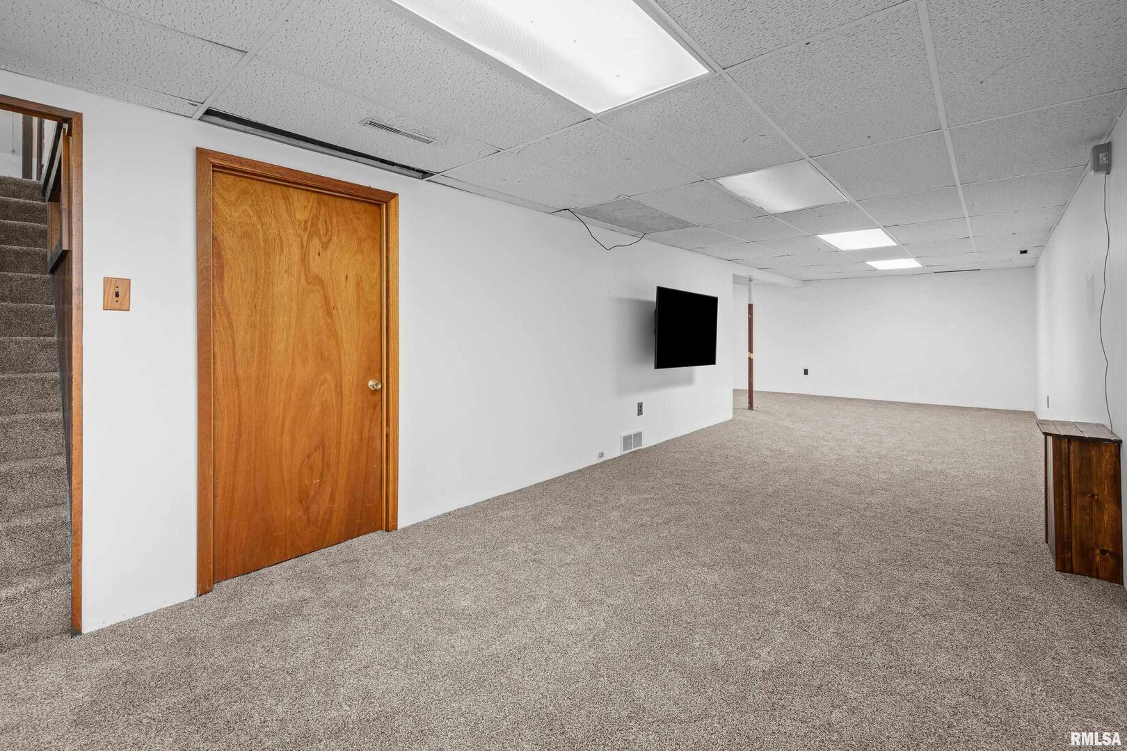 617 6th Street Camanche, IA 52730 - Photo 17 of 25 a view of an empty room with a window