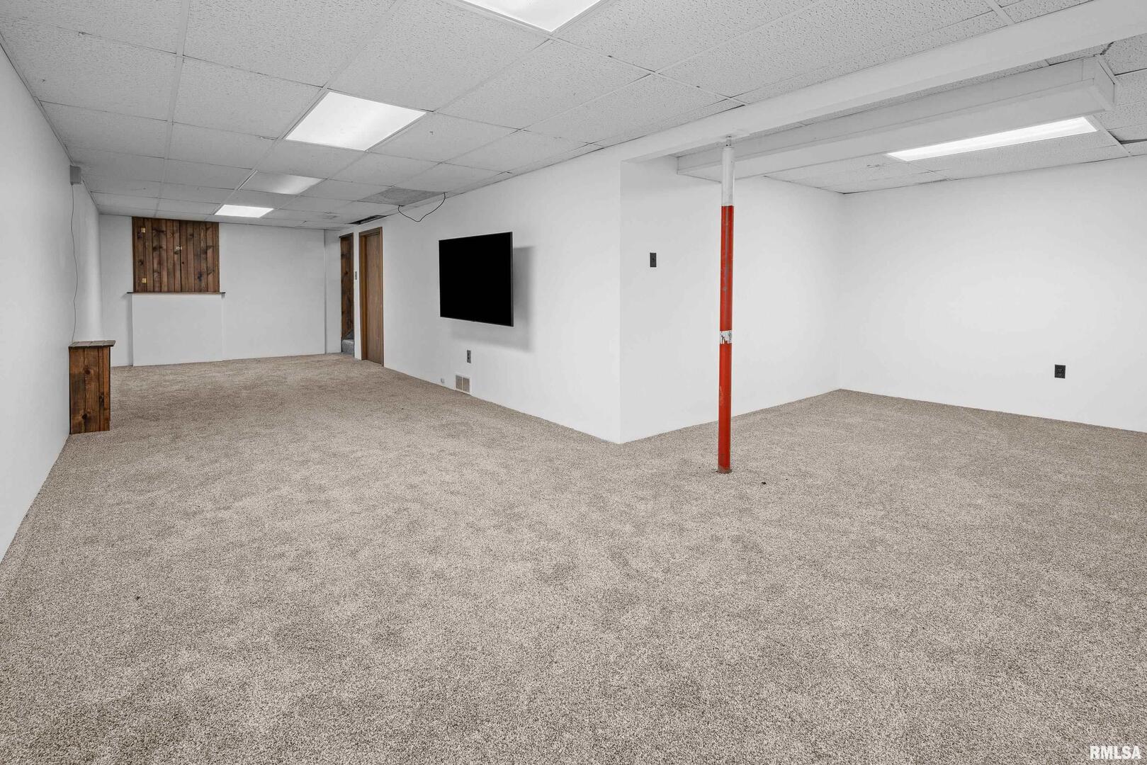 617 6th Street Camanche, IA 52730 - Photo 18 of 25 a view of a livingroom with an empty space and a window