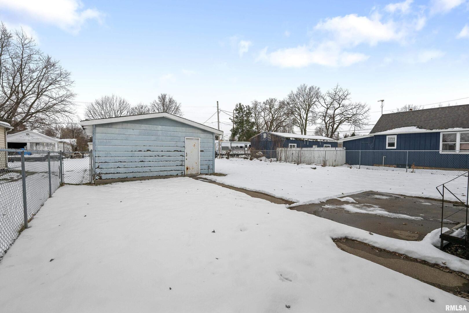 617 6th Street Camanche, IA 52730 - Photo 23 of 25 a view of a house with snow on the road