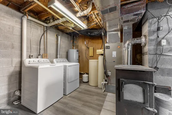 a view of a refrigerator a sink and dishwasher