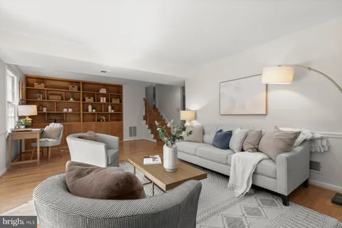 a living room with furniture and a table