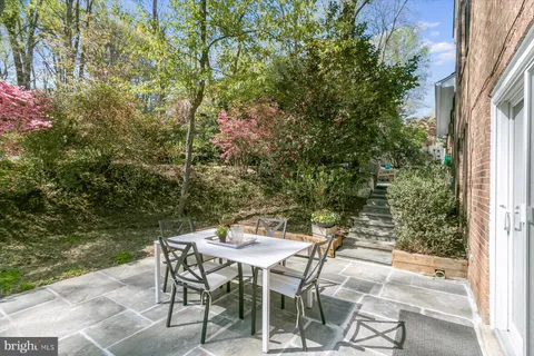a view of a outdoor seating area with a table and chairs