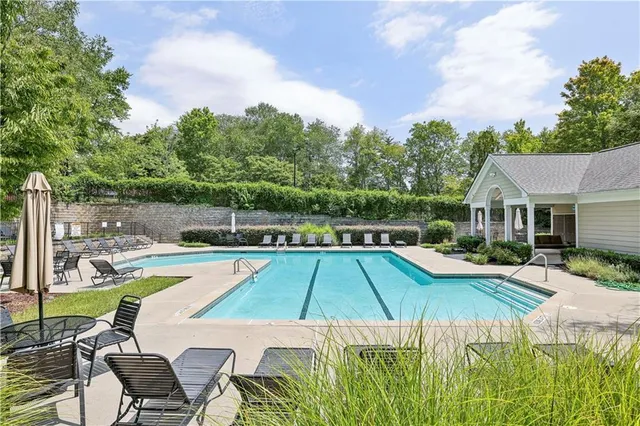 a view of outdoor space with sign board and garden