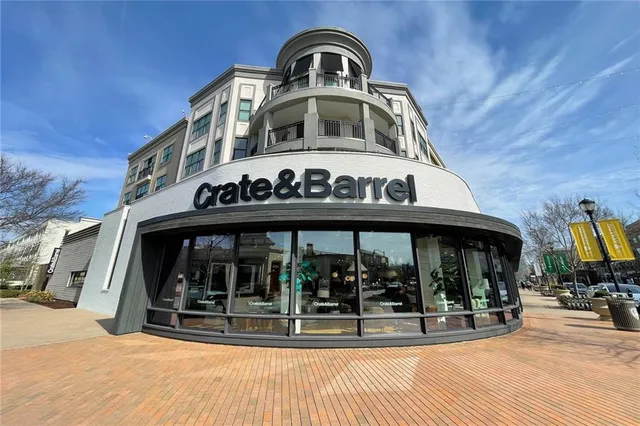 a view of a building with a window and sitting area